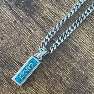 Like new Gucci Enamel pendant and sterling silver chain. Adjustable length.